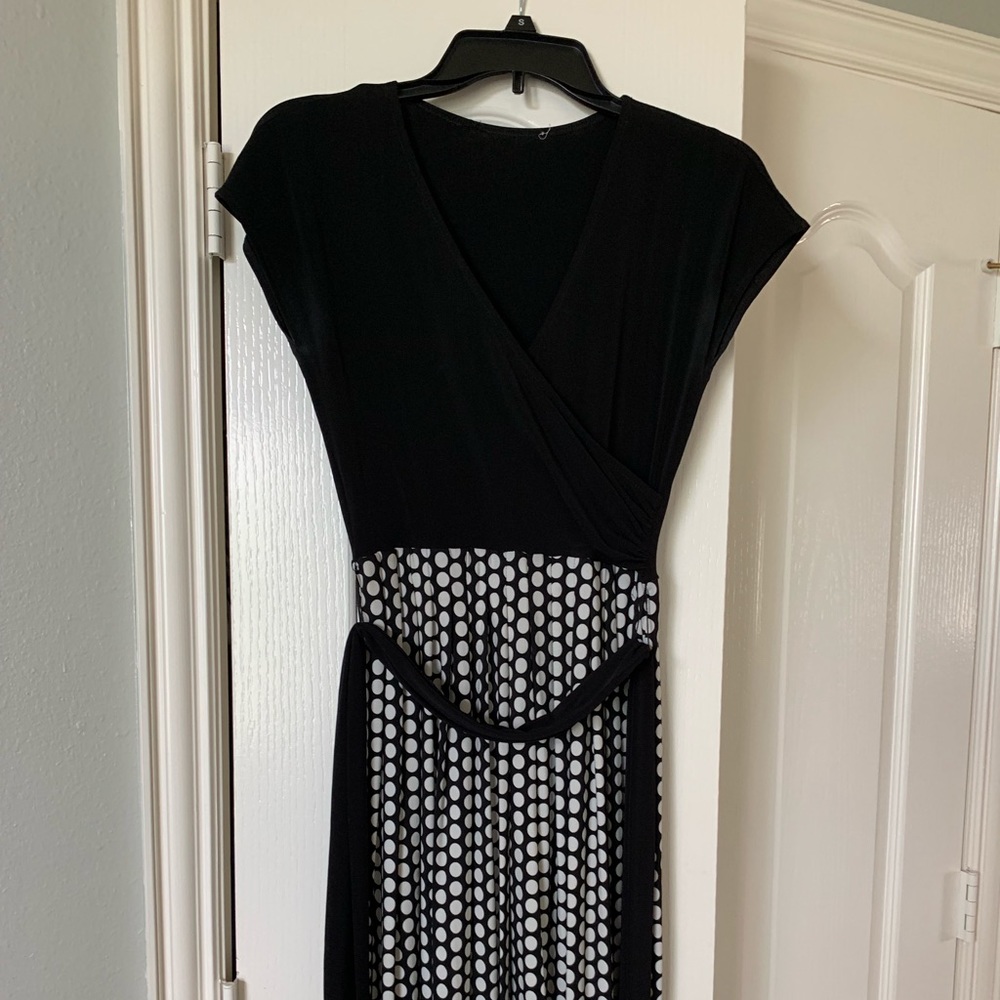Black dress with a black sash that wraps around